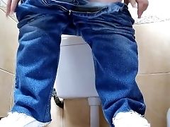 Hot Mummy In Jeans Pissing In A Public Restroom